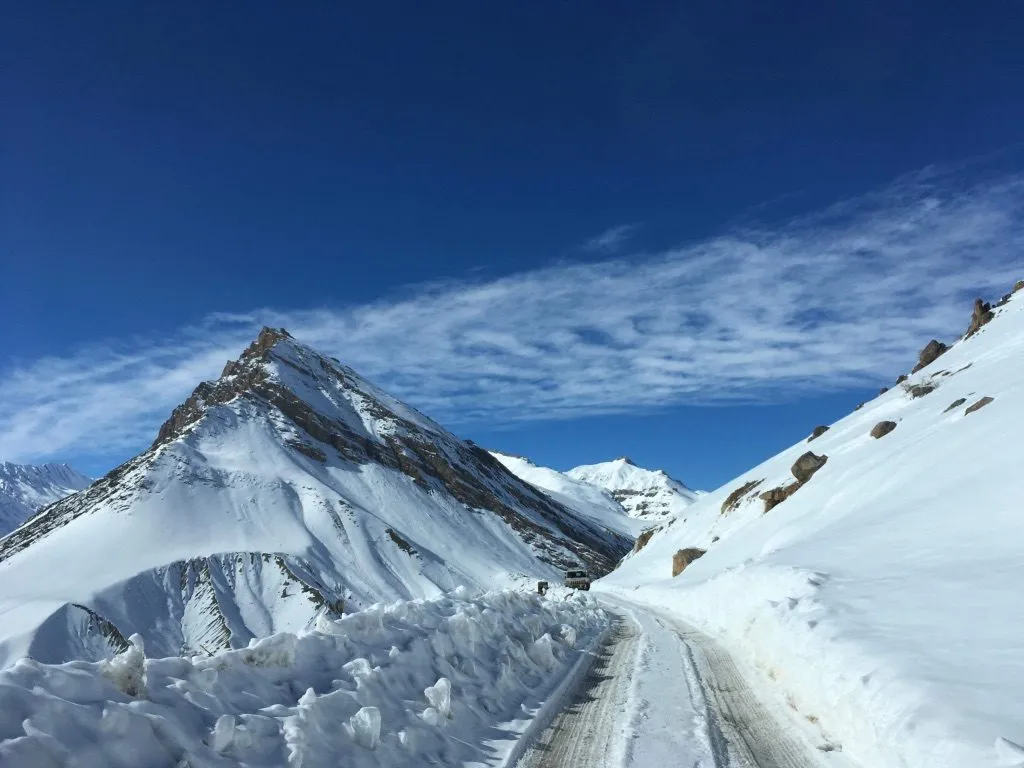 Snow-covered mountain road through Spiti Valley
